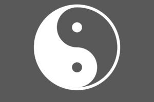 A gray and white Yin Yang symbol, illustrating part of the definition of Yin Yoga.