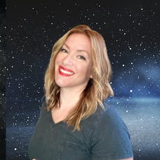 Brain-body wellness coach, Jessica Patching-Bunch smiling in front of a starry sky.