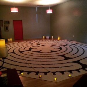 Peggy Burt's indoor labyrinth for walking meditation at Spiral Path Yoga Center.