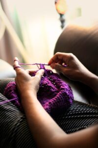 What are mindfulness skills you can develop while crafting, like this person mindfully crocheting or knitting.