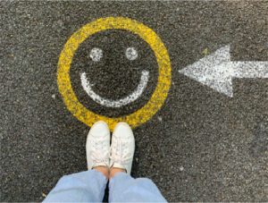 A smiley face painted on the ground, representing this meditation to cultivate joy.